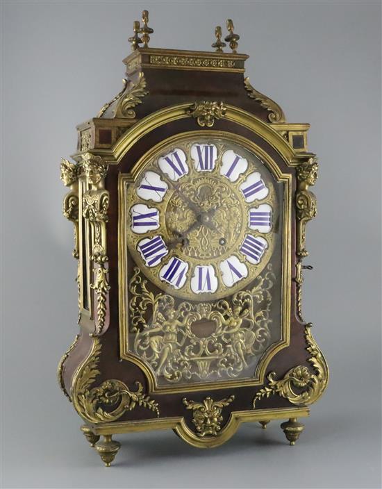 A 19th century French ormolu mounted red tortoiseshell mantel clock, 22.75in.